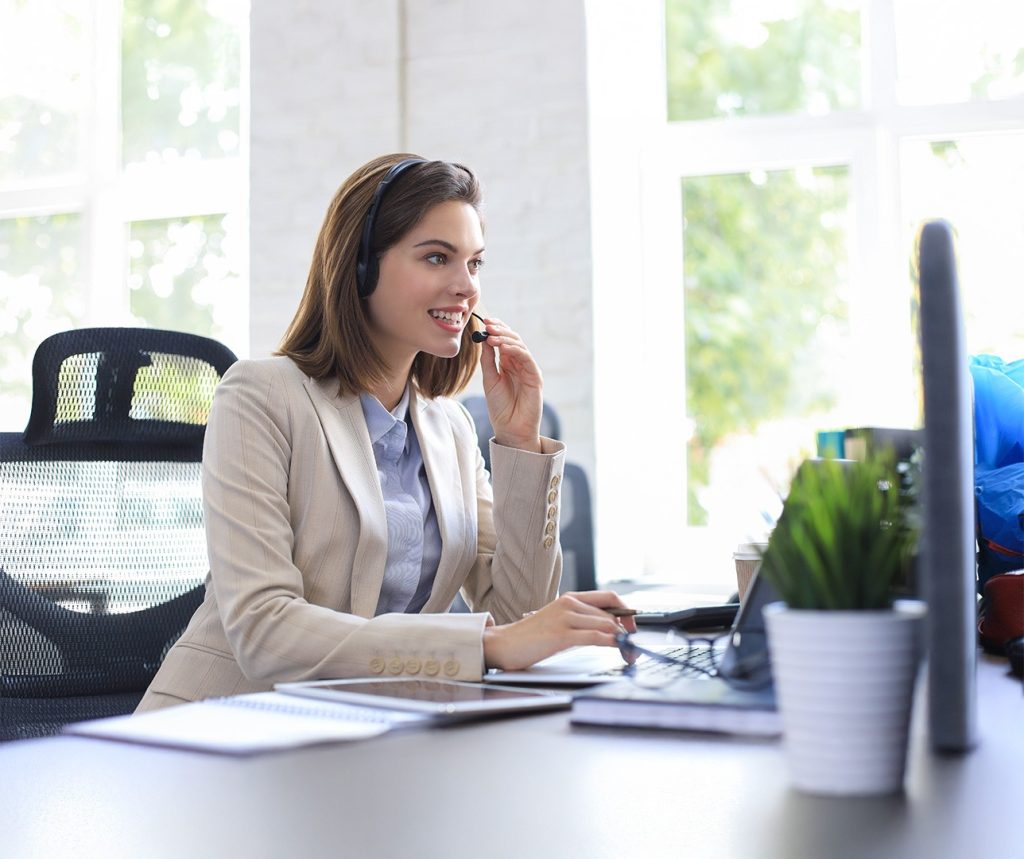 Consultant assisting client with UAE Golden Visa eligibility assessment on computer