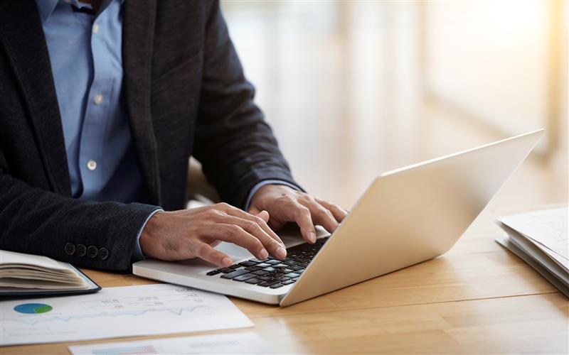 Professional man working on laptop for business and corporate services