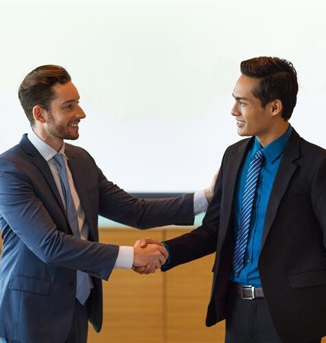 Business partners handshake after Freezone Company Formation in Dubai, UAE