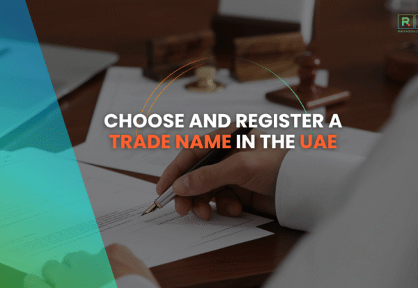 Business professional signing documents for UAE trade name registration.
